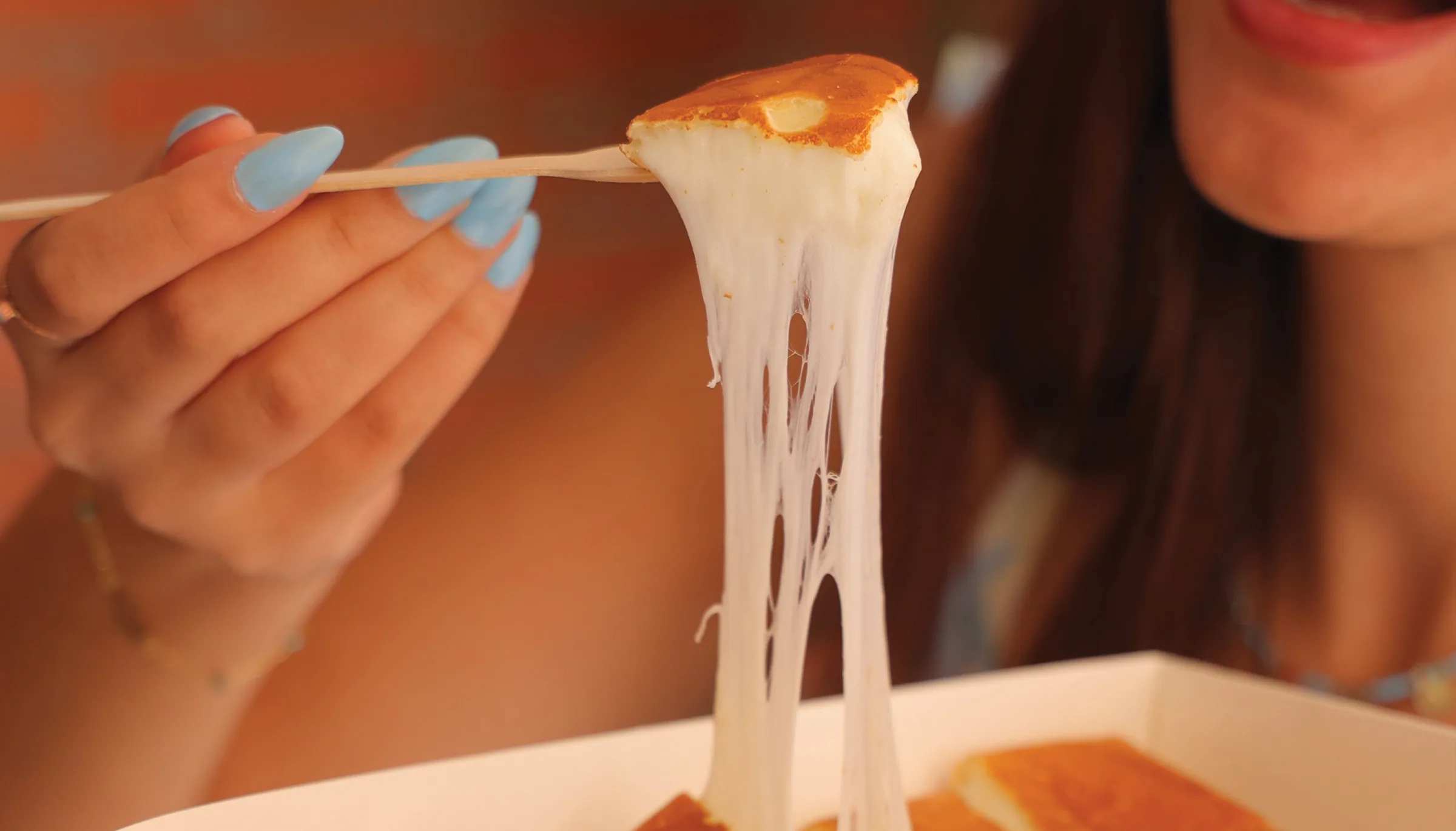 Warm savory crepe with a melted cheese pull