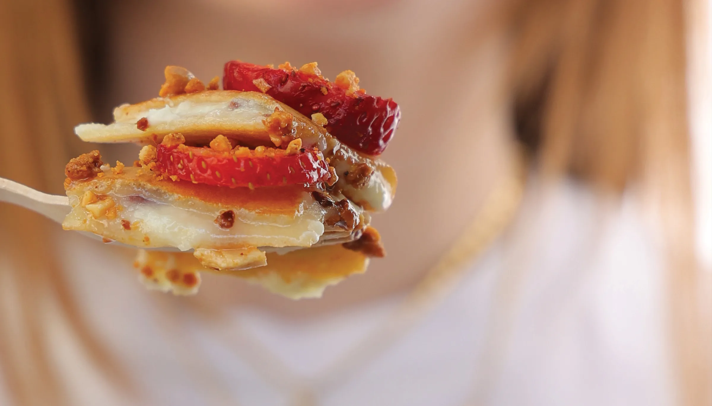 Strawberry crepe bite with chocolate and crumble