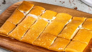 Hersheys: Tonino crepe cut into bite-sized squares on a wooden board